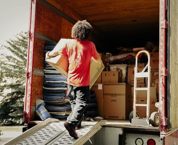 stallion person holding box from back